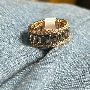 Size 7 rose gold and rainbow topaz.